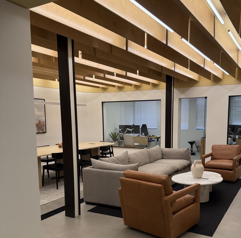 Lounge and conference room under a wood slat ceiling