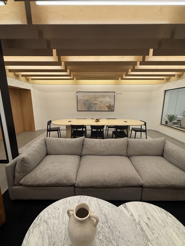 Lounge sectional sofa facing the conference area