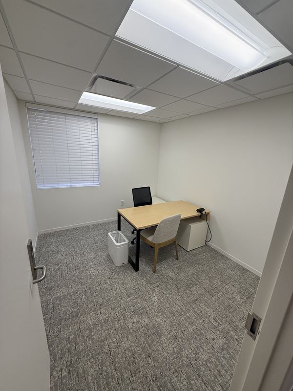 Office 4: private office with desk, chairs and filing cabinet